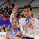Bronze medalists Ryom Tae Ok and Kim Ju Sik of North Korea pose for photographers during the victory ceremony of the Pairs event of Figure Skating competition at Makomanai Indoor Skating Rink at the Asian Winter Games in Sapporo, northern Japan, Saturday, Feb. 25, 2017.